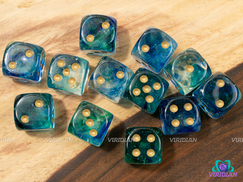 Nebula Oceanic & Gold D6 Set (12) | Blue Green & Clear Glow-in-the-Dark (Luminary) | 16mm D6 Block (12) | Chessex